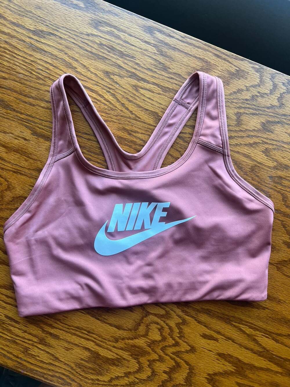 Nike Dri-FIT Swoosh Futura Medium Support Sports Bra in Pink
